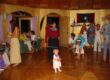 Indoor party with toddler and adults