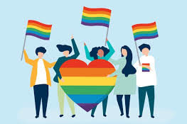 Five diverse people holding rainbow pride flags and a heart symbolizing LGBTQ+ support.